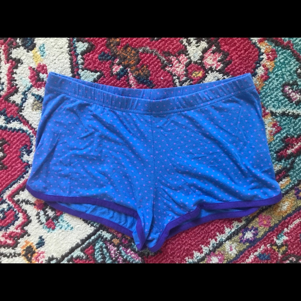 Blue sleep shorts with purple dots and trim